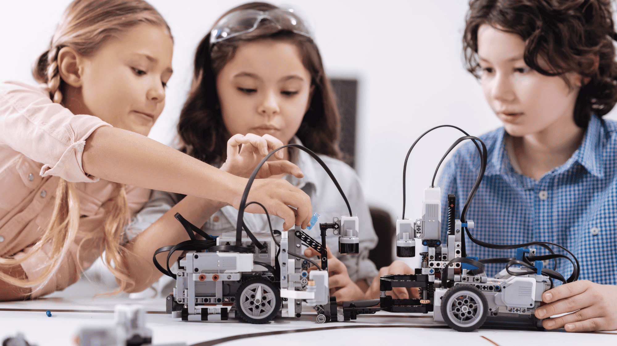 Young child learning coding and robotics to build essential life skills